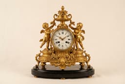 Каминные часы с путти, бронза и мрамор — миниатюра 1